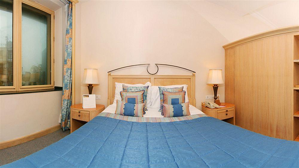 The Orchid Hotel Mumbai Vile Parle Exterior photo A bedroom at the hotel