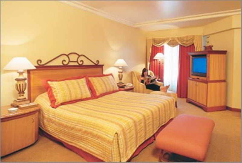 The Orchid Hotel Mumbai Vile Parle Room photo A bedroom at the hotel